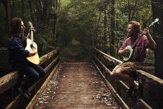 The Rupple Brothers on a bridge in a mystical forest.